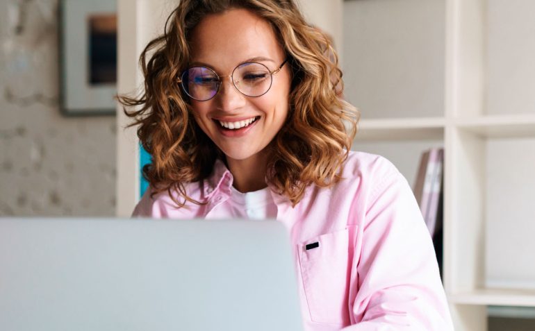 photo-of-joyful-woman-wearing-eyeglasses-smiling-a-8EUXMDJ.jpg